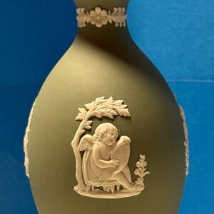 Purchased in England and kept in display case. 2 inches wide x 5 inches tall.